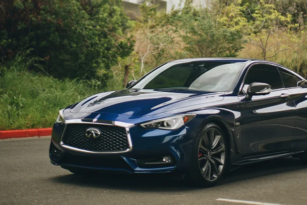 Blue Infiniti coupe parked in lot