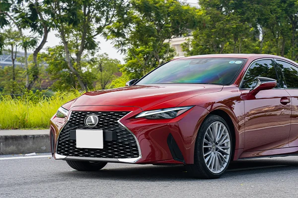Red Lexus sedan parked on street